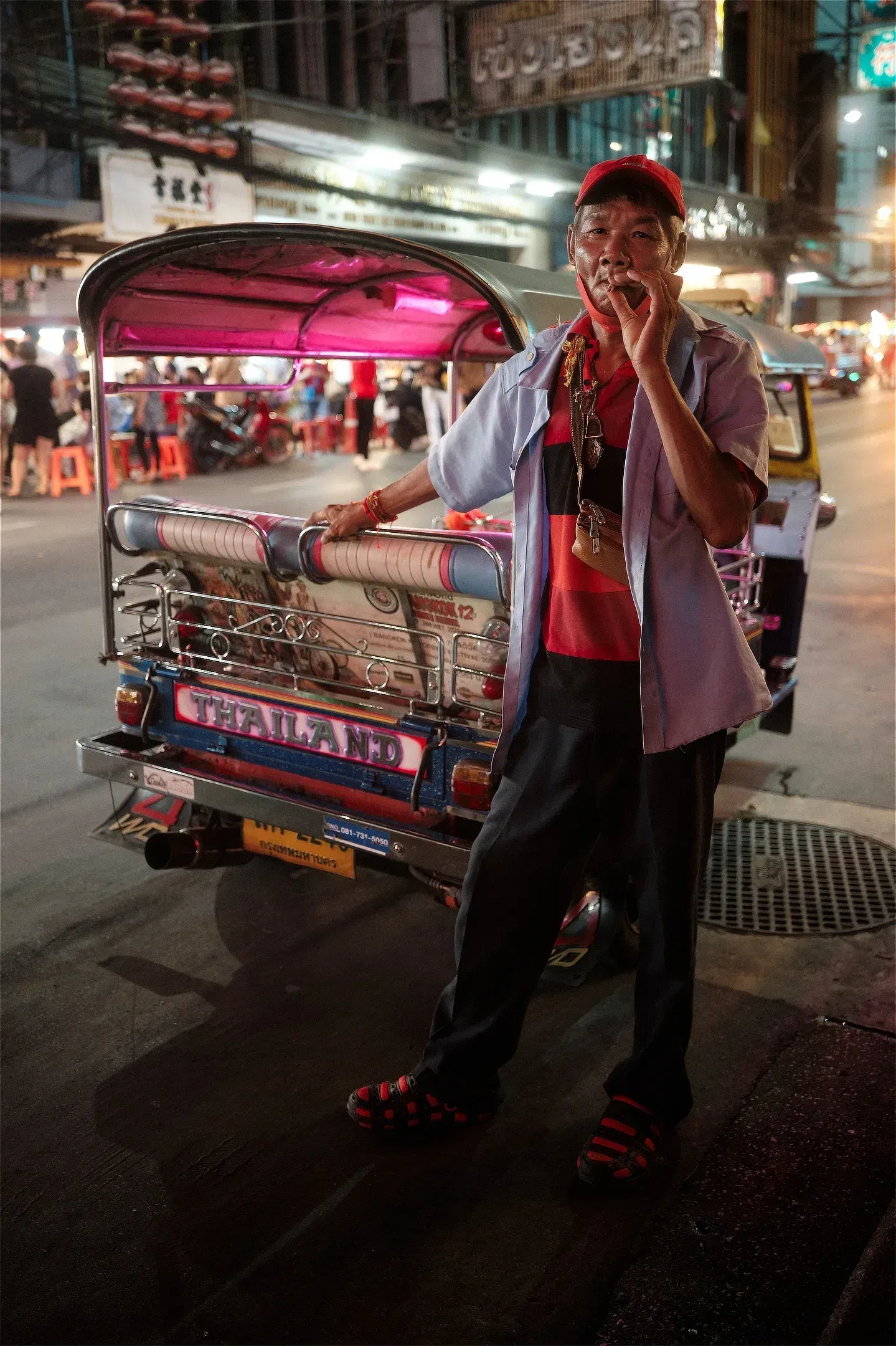 Bangkok tuk tuk driver smoking